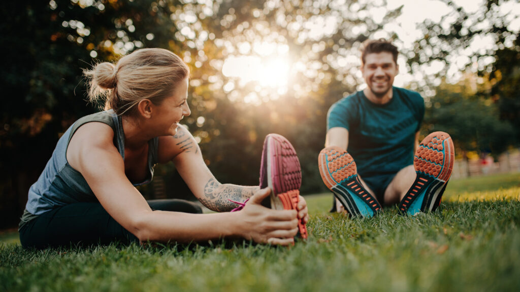 Image of a couple stretching after training