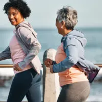 photo of two women walking for fitness