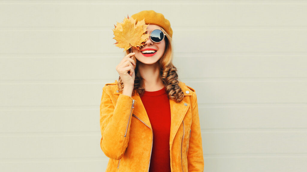 Image of a young woman dressed in colorful autumnal clothing