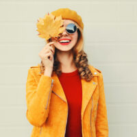 Image of a young woman dressed in colorful autumnal clothing