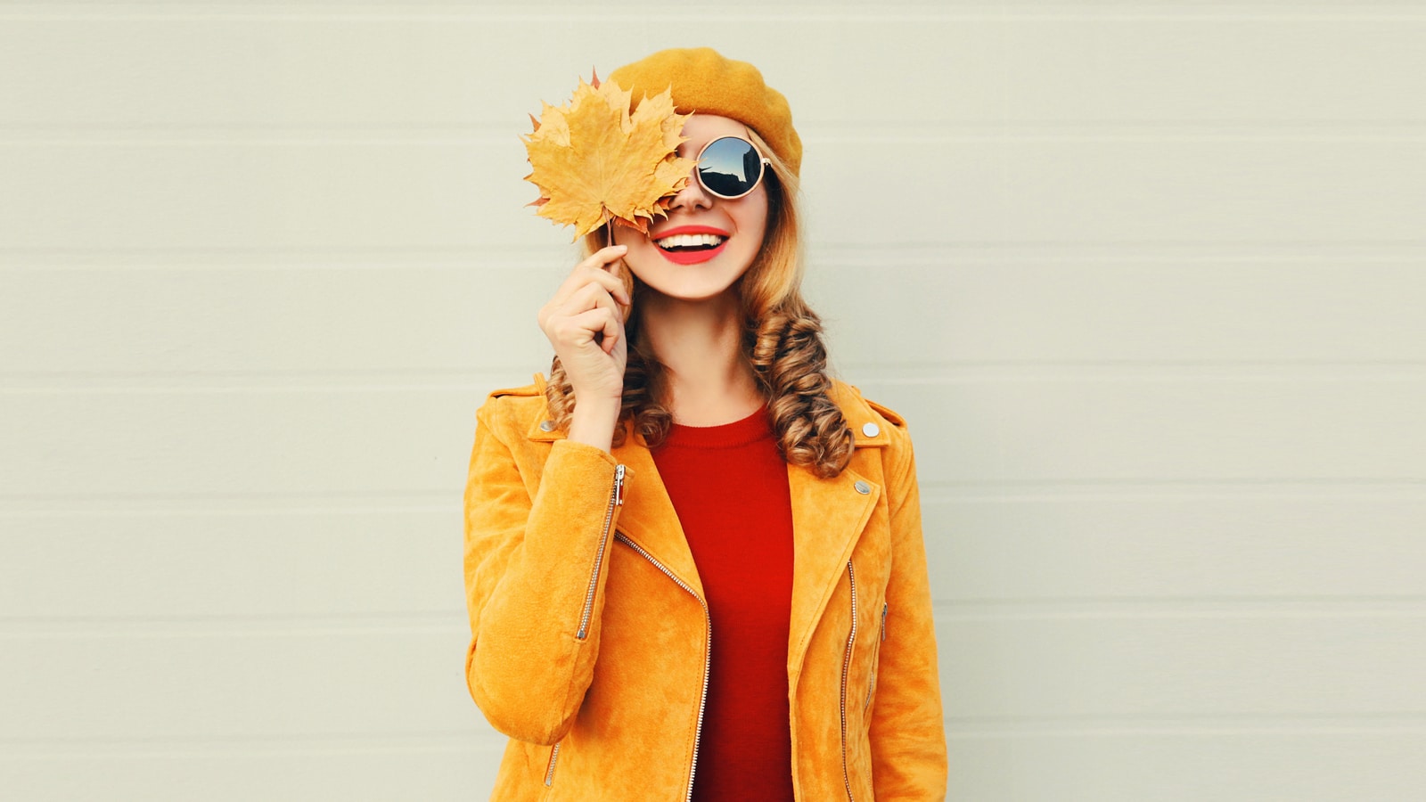 Image of a young woman dressed in colorful autumnal clothing