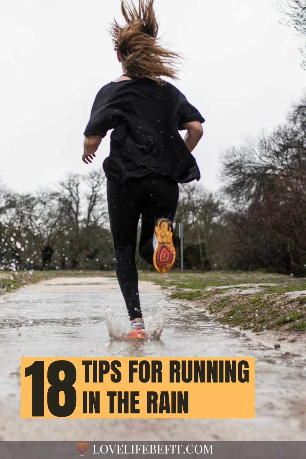 image of a woman running in the rain and splashing through puddles