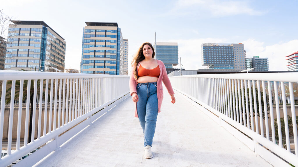 Image of a young overweight woman walking for exercise