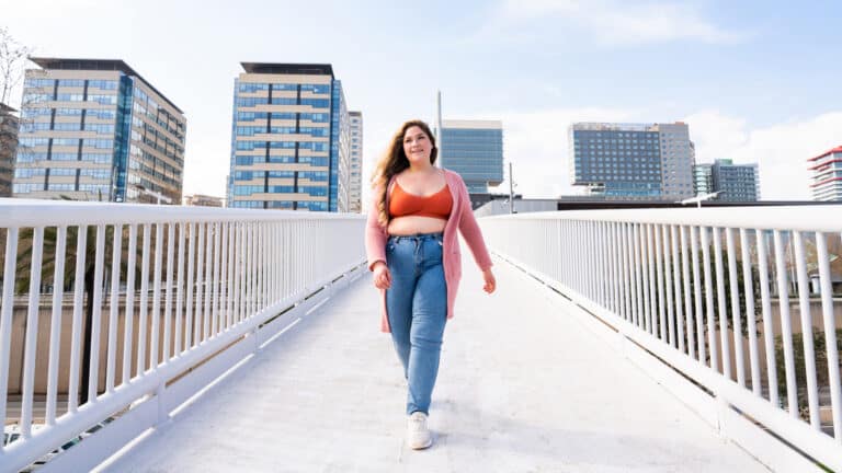 Image of a young overweight woman walking for exercise
