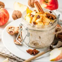 apple cinnamon overnight oats pictures with cinnamon sticks, walnuts and star anise