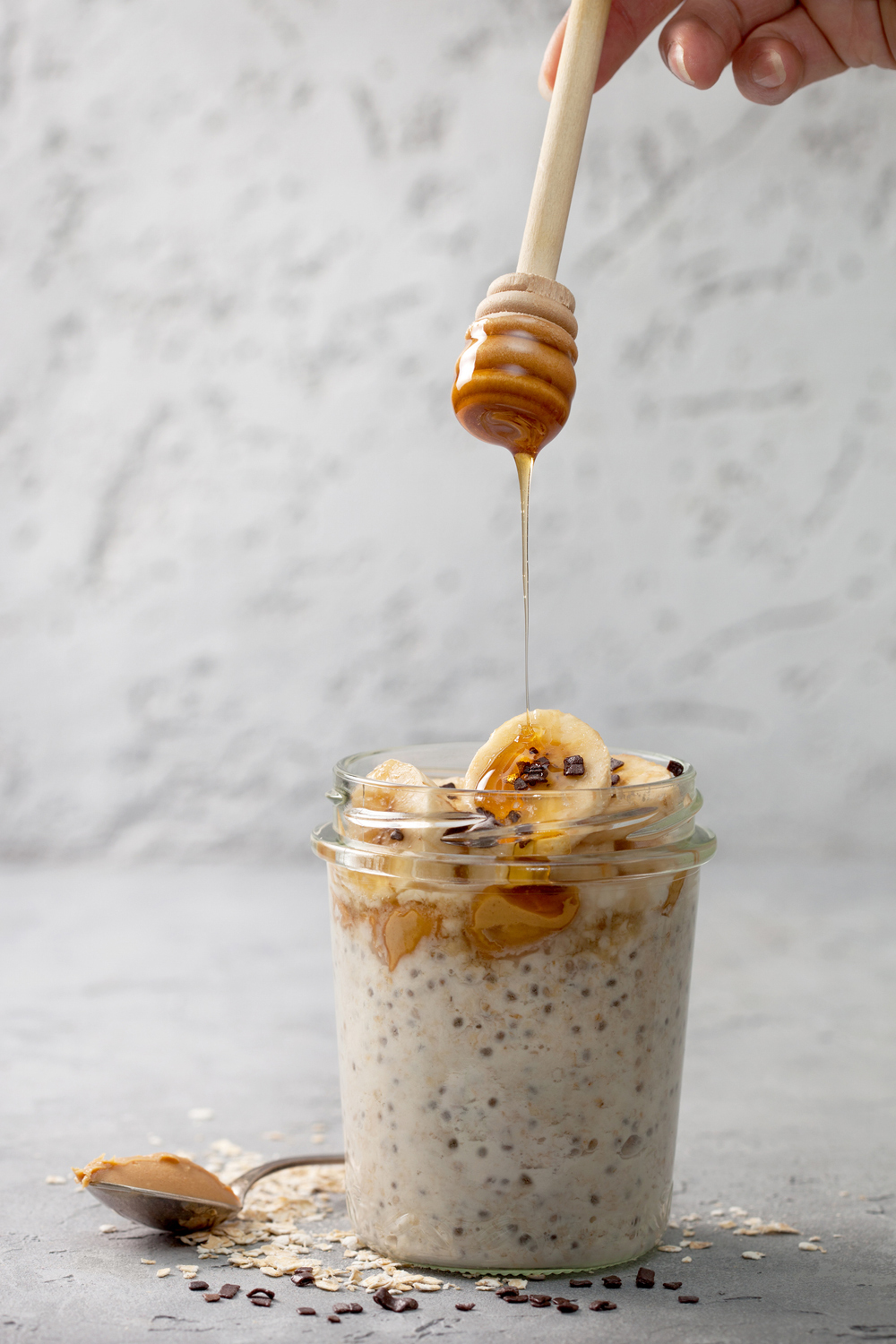 Image of peanut butter banana overnight oats drizzled with maple syrup