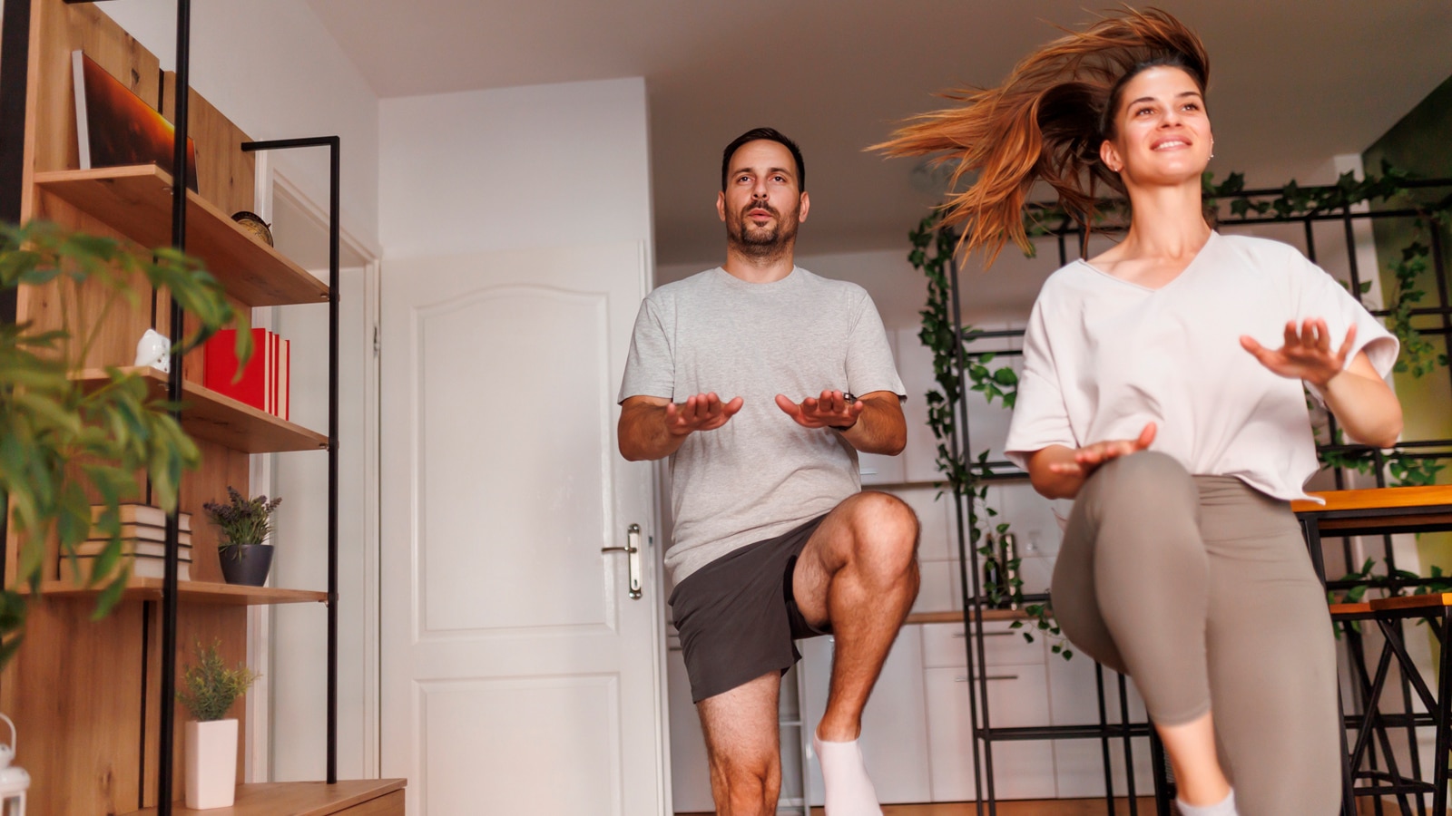 Image of a couple taking part in a home workout for beginners