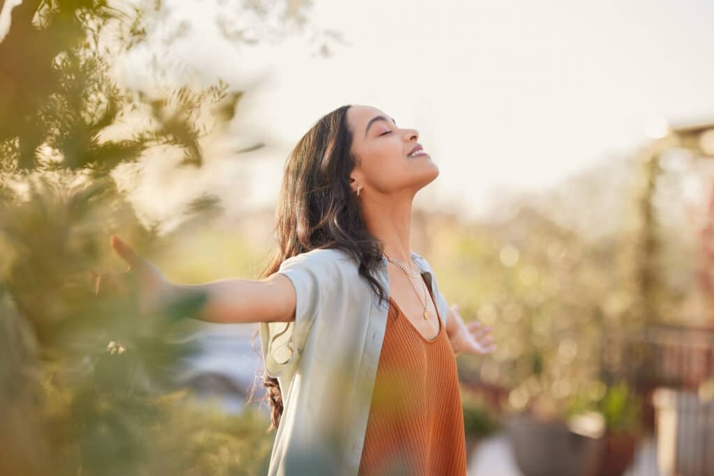 Image of a young woman enjoying the benefits of mindfulness