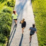 Image of three runners following an interval running workout