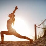 Image of woman following a yoga sequence of yoga poses for runners