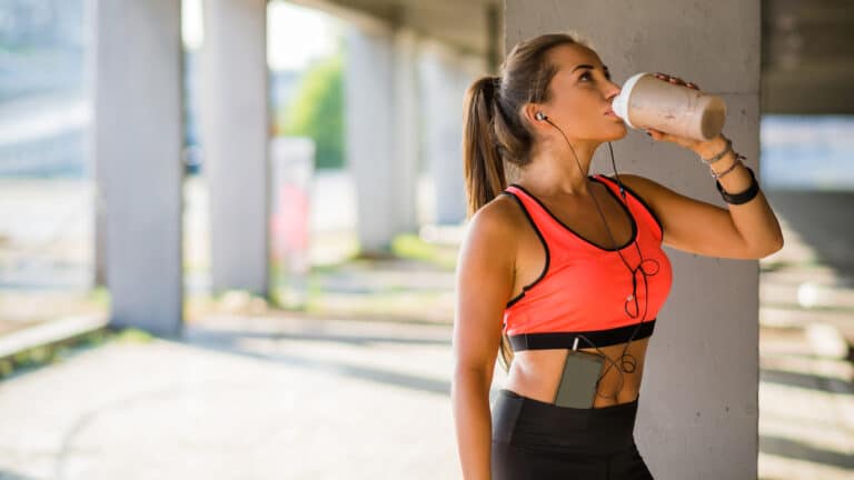 Image of a woman drinking a protein shake