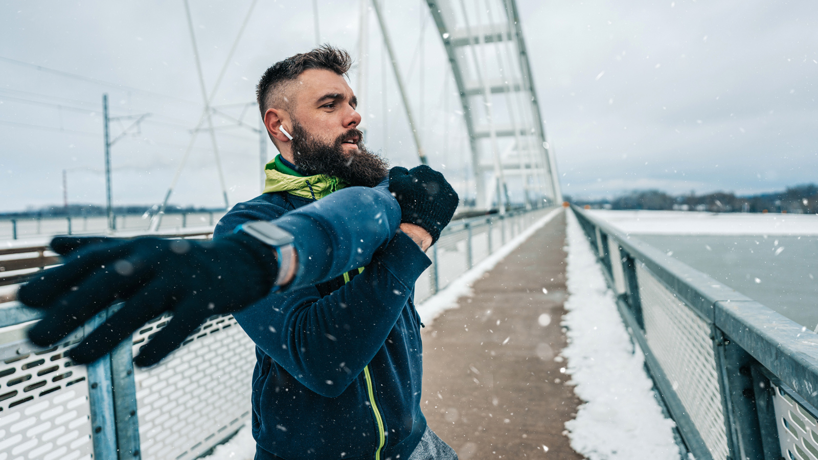 Image of a man warming up for a winter run