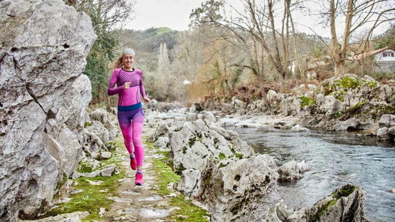 Image of a woman running in winter wearing her new Christmas running gifts