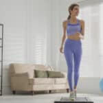 Image of a woman doing an indoor walking workout