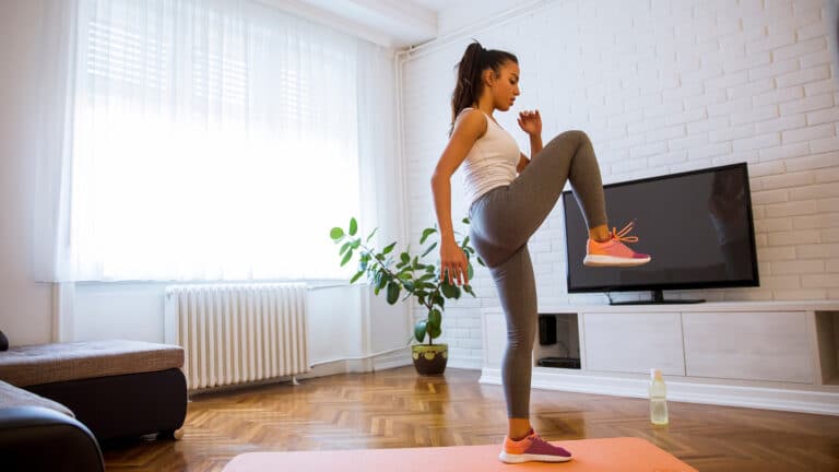 Young woman enjoying an indoor walking workout