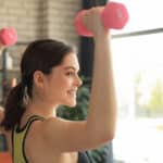 Image of a woman doing shoulder workout exercises