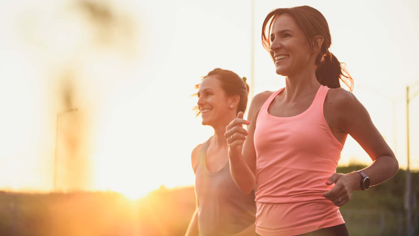 Image of two women running