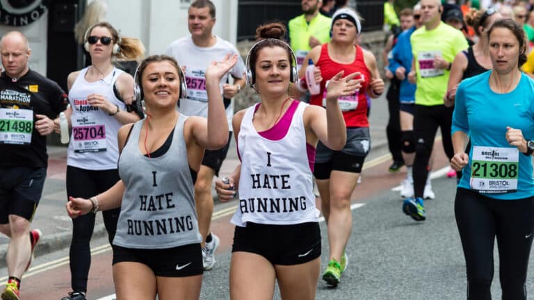 Image of runners in a half-marathon wearing "I hate running" vests.
