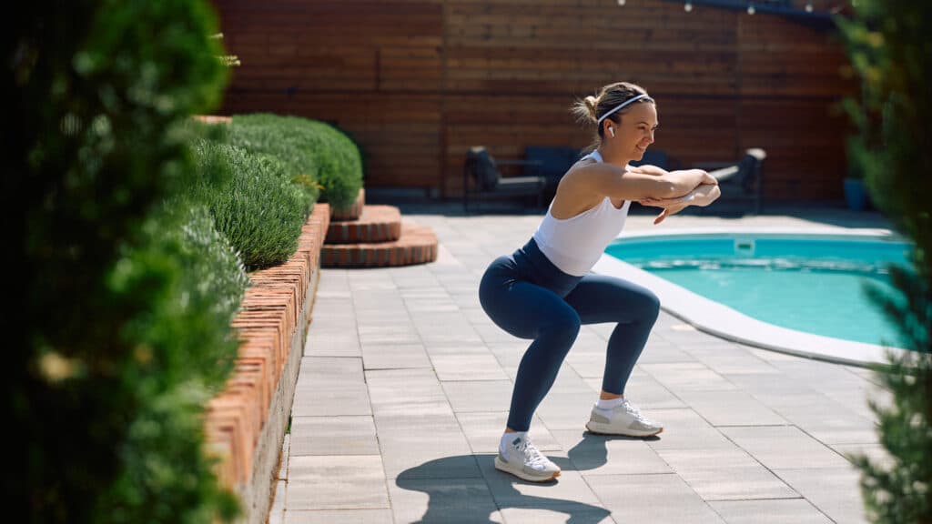 Image of a woman performing a squat exercise