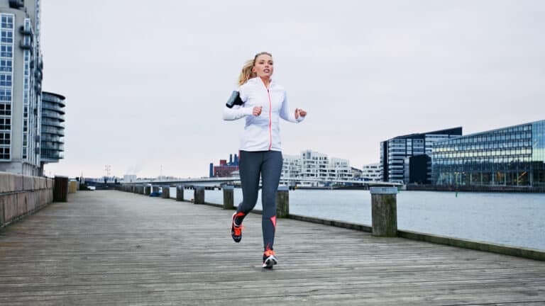 Image of a woman running and training for 10K
