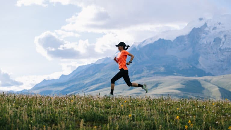 Image of a woman running in beautiful surroundings