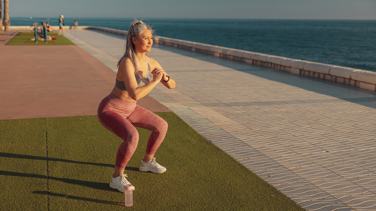Image of a woman performing a squat